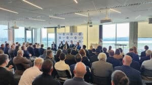 Mission Focus panel in front of a USGIF background with a sear crowd facing them
